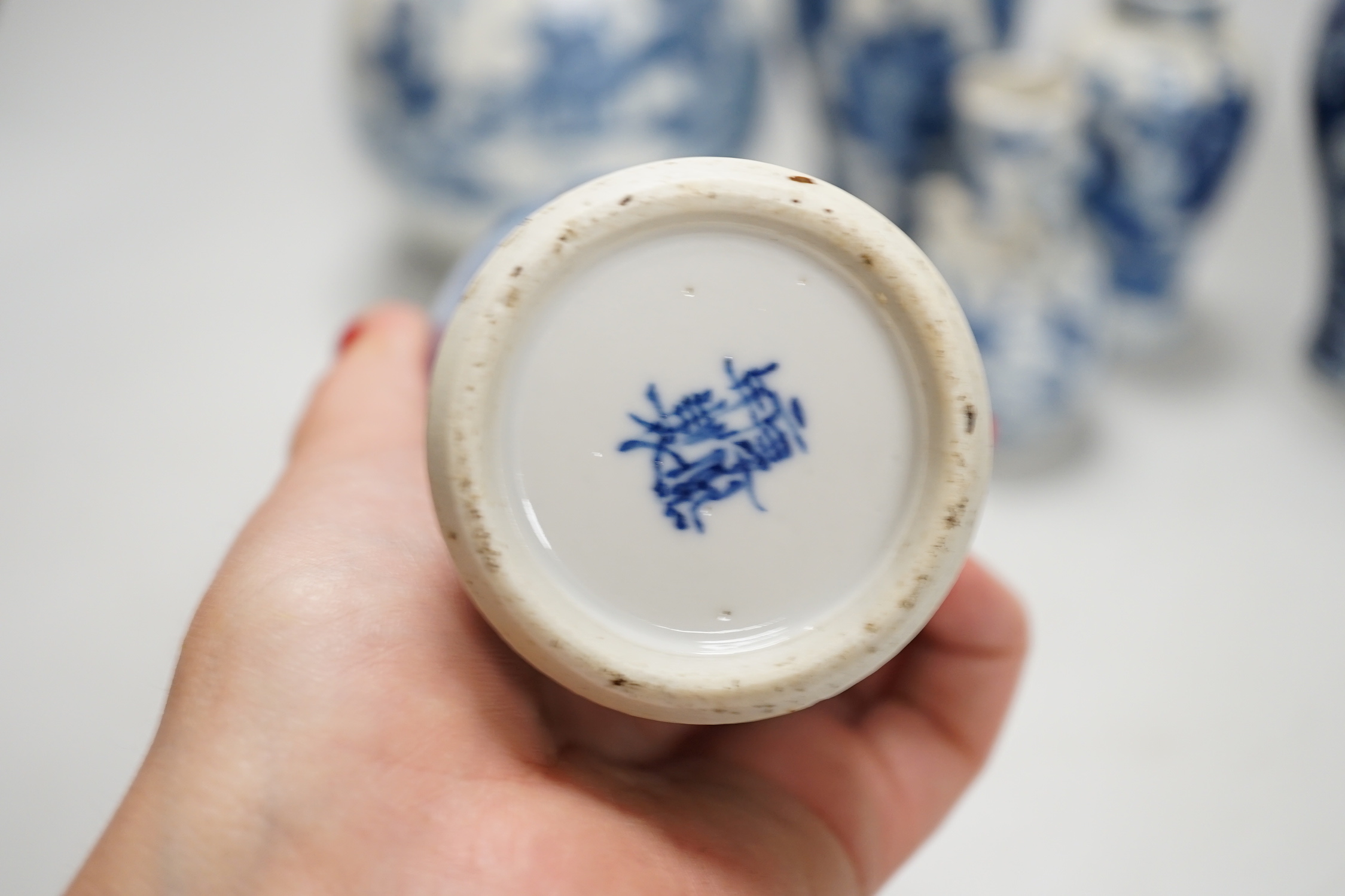 A Chinese armorial blue and white bottle vase, Qianlong/Jiaqing period, and five assorted 19th century Chinese blue and white vases, tallest 20cm; faults